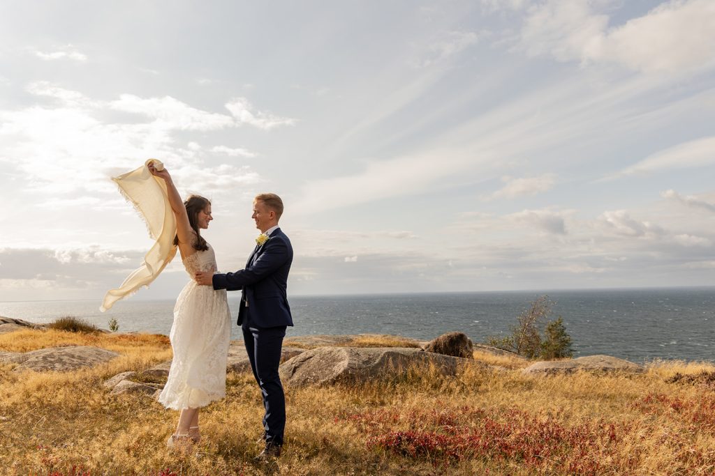 Joyful bride and groom after their legal wedding ceremony in the beautiful nature of Bornholm, Denmark